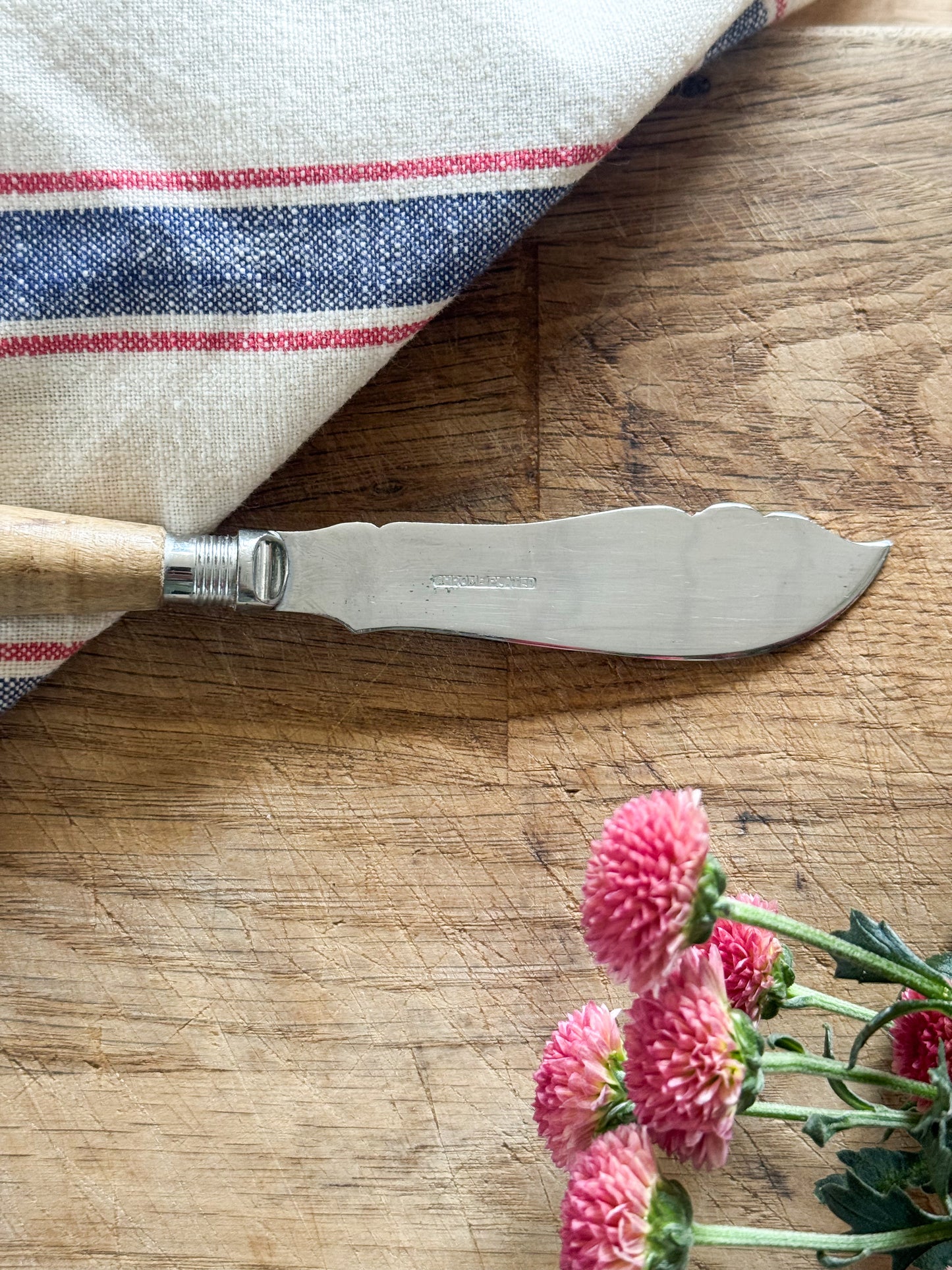 Vintage Chrome Plated Butter Knife with Hand-Carved Handle “Lands End”